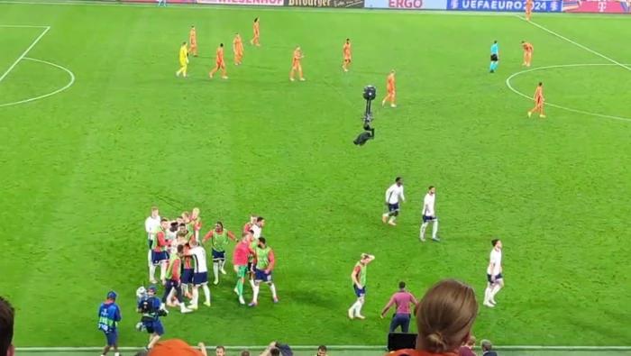 England substitutes spill onto pitch as Ollie Watkins scores last minute winner