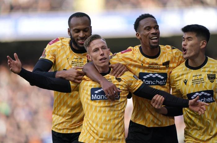 Maidstone United celebrating their FA Cup win over Ipswich Town