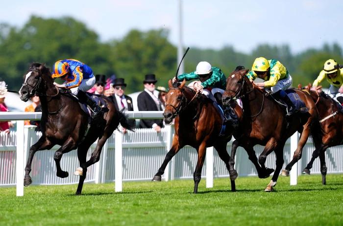 Auguste Rodin ridden by jockey Ryan Moore on their way to winning the Prince Of Wales's Stakes during day two of Royal Ascot