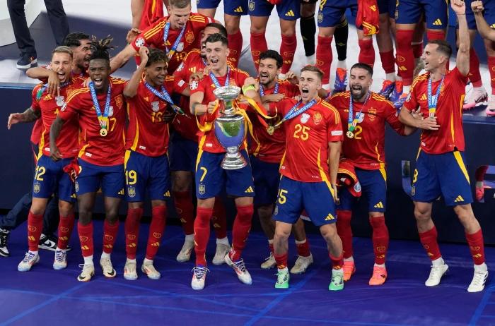 Alvaro Morata lifts the Euro 2024 trophy for Spain