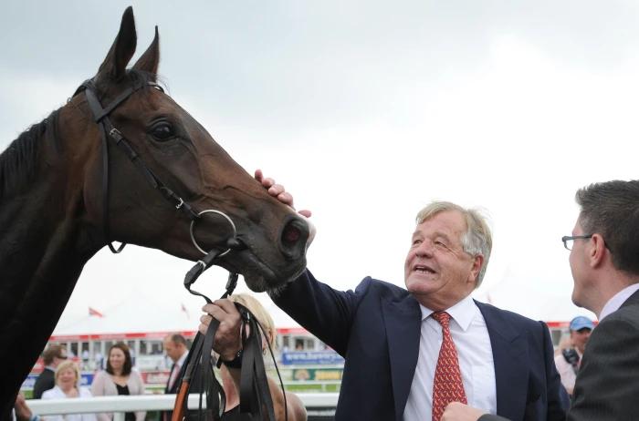 Trainer Sir Michael Stoute congratulates Estimate after winning the Doncaster Cup in 2014