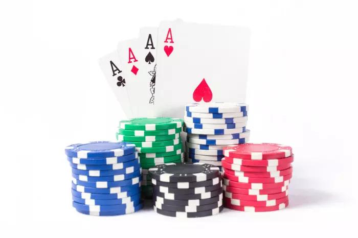 4 aces and poker chips on white background