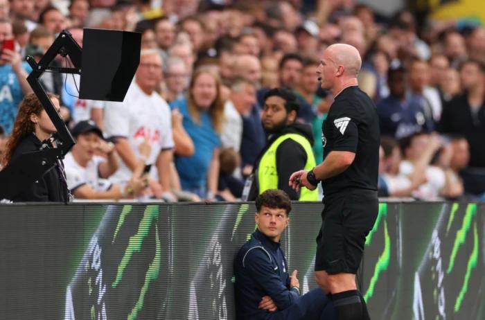 Referee Simon Hooper checking monitor