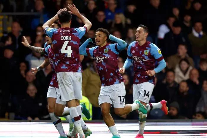 Burnley's Manuel Benson (centre) celebrates scoring