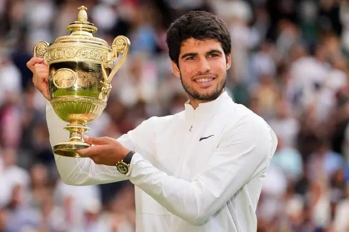 Carlos Alcaraz with Wimbledon trophy