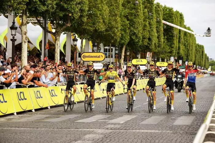 Danish Jonas Vingegaard of Jumbo-Visma and his teammates cross the finish line of the 21st and last stage of the Tour de France - July 2023