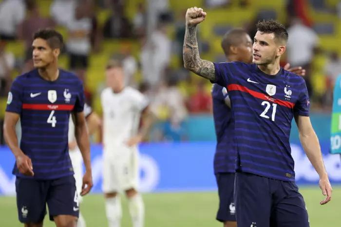 Members of the France team celebrate their 1-0 win over Germany after the final whistle