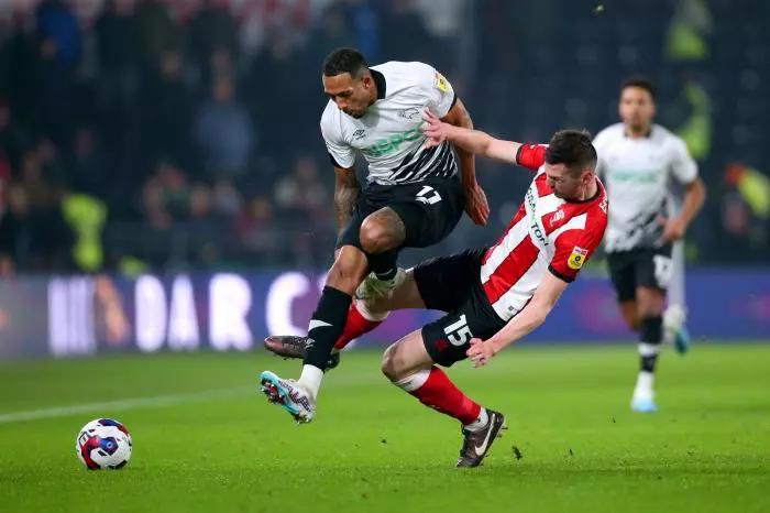 Derby County's Nathaniel Mendez-Laing and Lincoln City's Paudie O'Connor