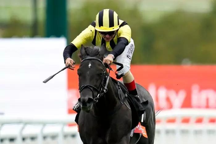 Vandeek ridden by Andrea Atzeni on their way to winning the Markel Richmond Stakes during day three of the Qatar Goodwood Festival