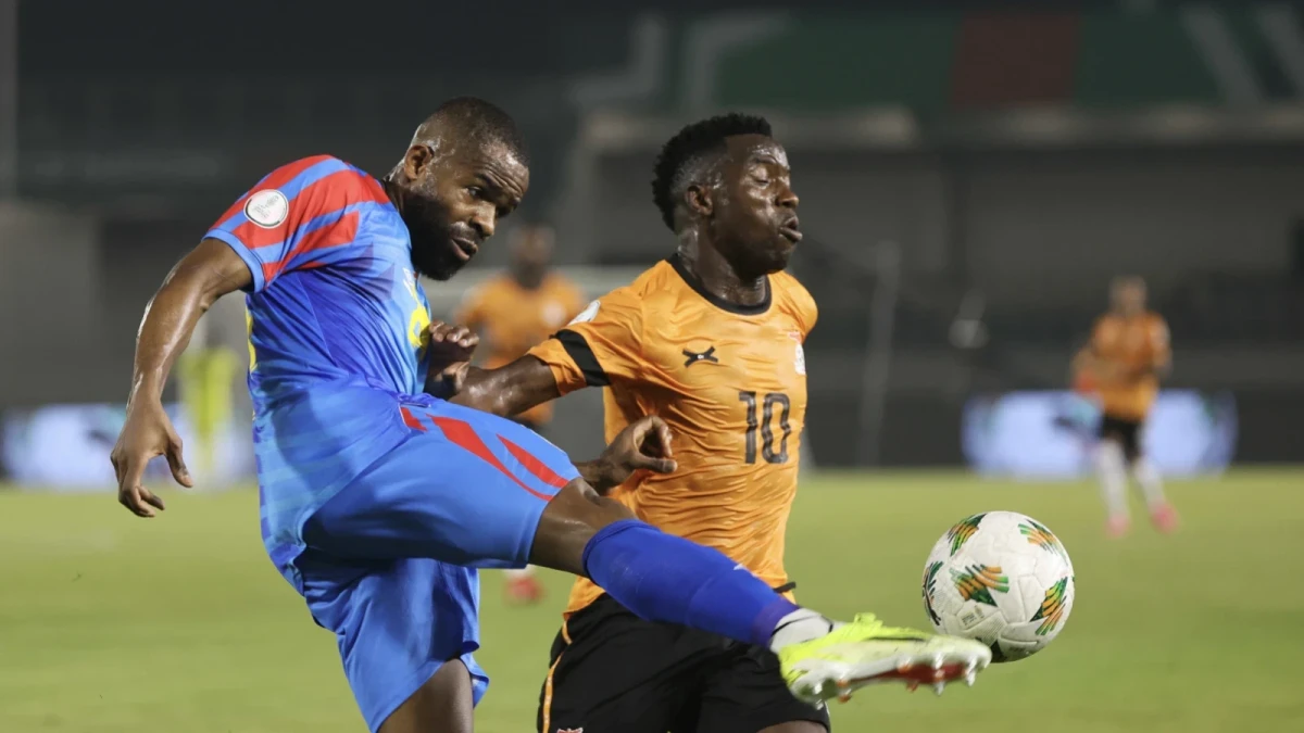 Fashion Junior Sakala of Zambia tackled by Gedeon Tchingoma Kalulu Kyatengwa of DR Congo Jan 17, 2024