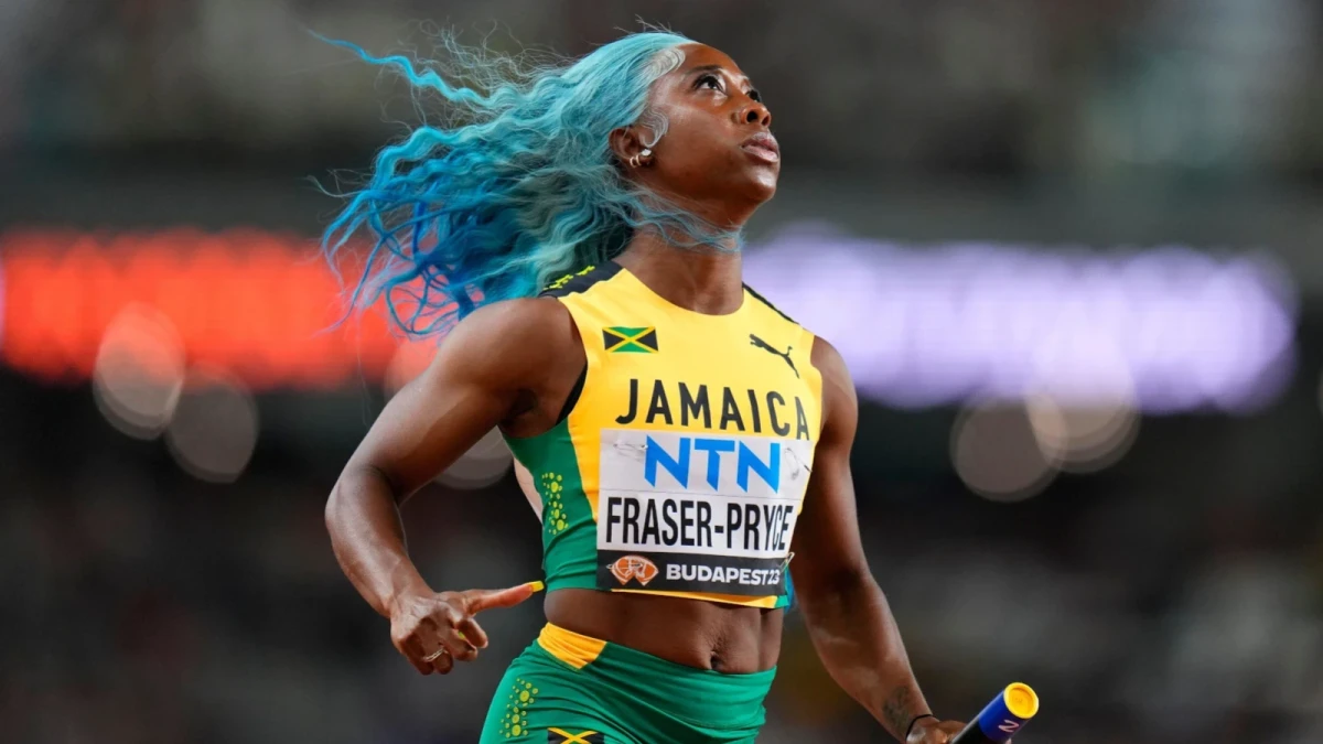 Shelly-Ann Fraser-Pryce, of Jamaica anchors her team to win a Women's 4x100-meters relay heat during the World Athletics Championships in Budapest
