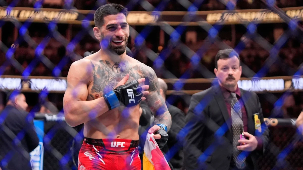 Ilia Topuria celebrates after knocking out Alexander Volanovski during their featherweight bout at the UFC 298 mixed martial arts event Saturday