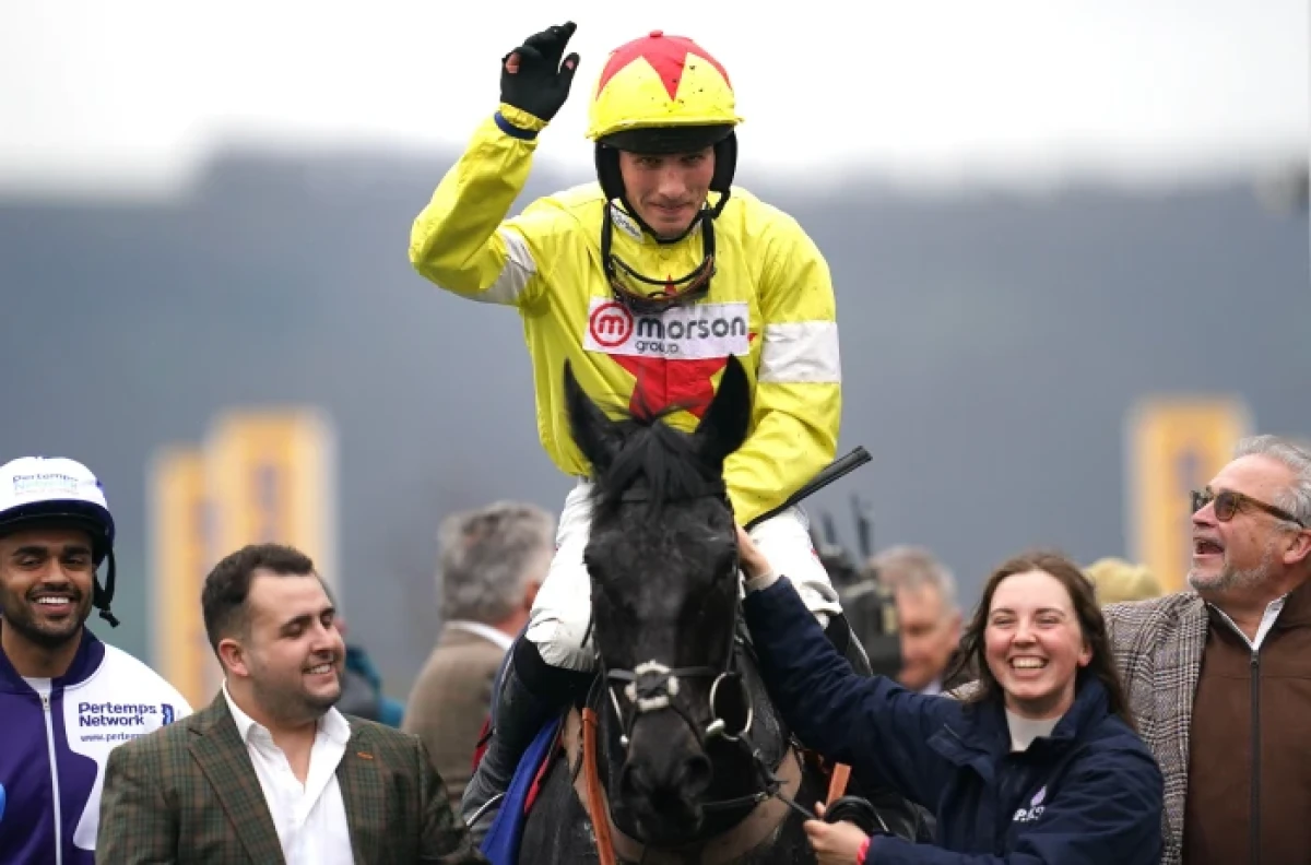 Planet Sport Bet ambassador Harry Cobden celebrating his Pertemps Final win aboard Monmiral