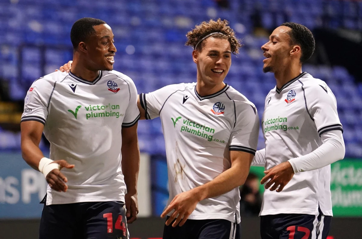 Bolton Wanderers Victor Adeboyejo, Dion Charles and Josh Dacres-Cogley celebrate