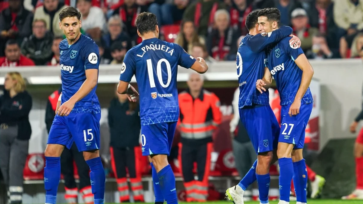 Nayef Aguerd of West Ham celebrates with teammates after scoring.