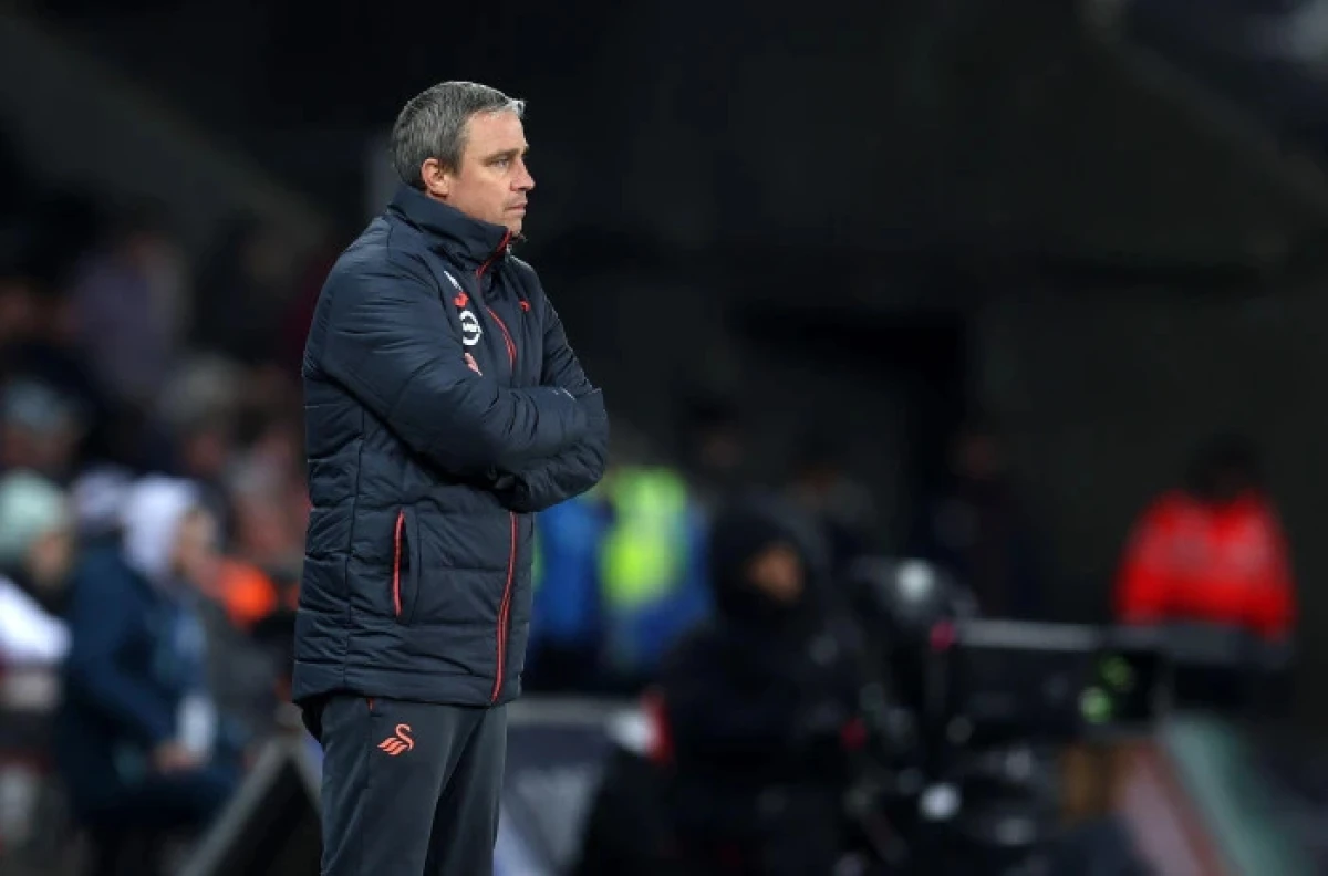 Michael Duff, the former head coach/manager of Swansea City looks on from his technical area - Dec 2023