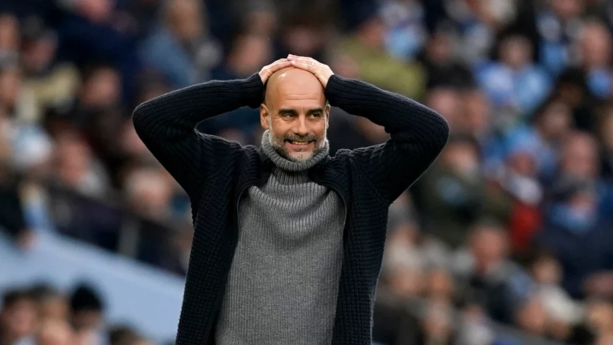 Pep Guardiola with head in hands