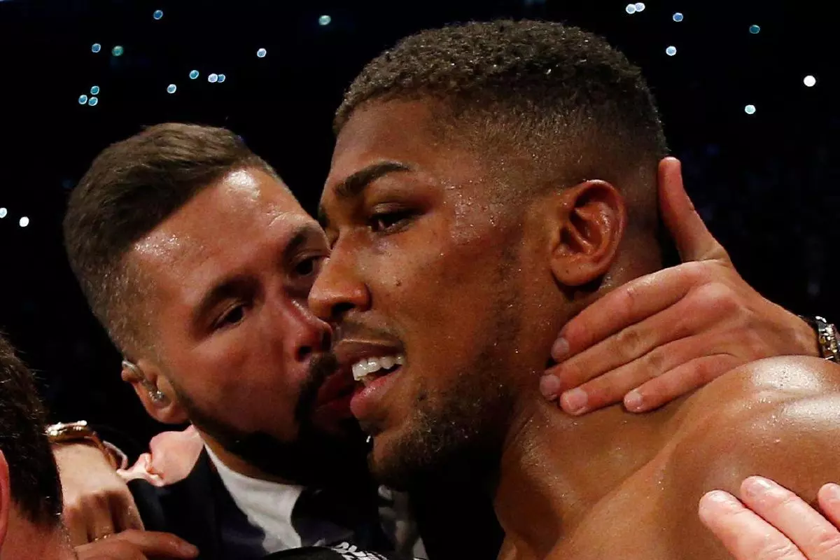 Anthony Joshua celebrates with Tony Bellew