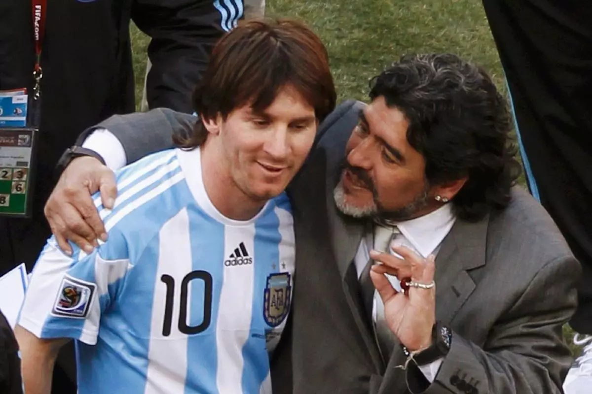 Argentina's coach Diego Maradona hugs Lionel Messi