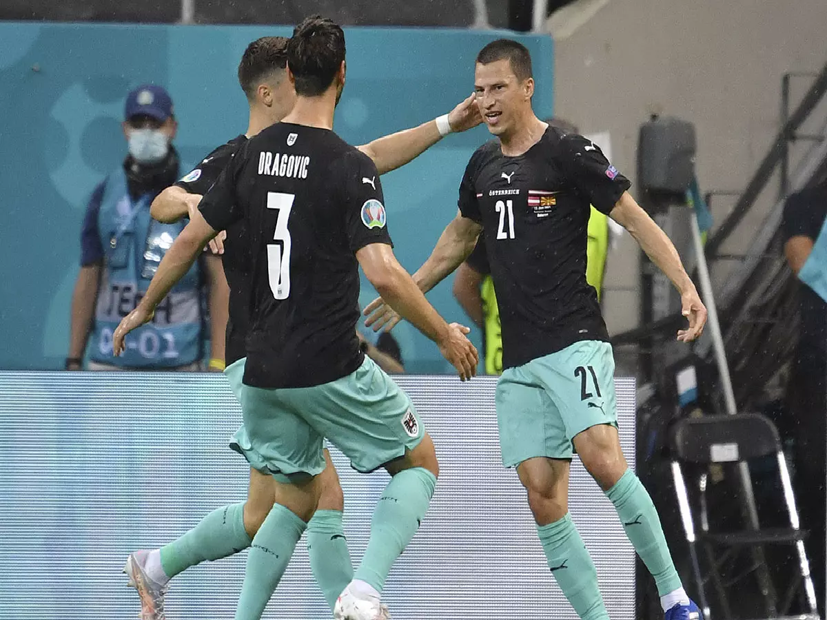 Stefan Lainer of Austria celebrates