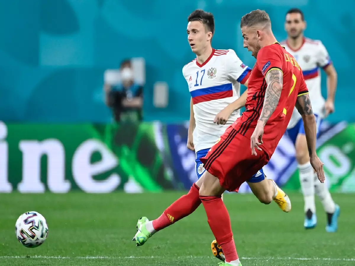 Belgium's Toby Alderweireld and Russia Aleksandr Golovin battle for possession. Credit: Dirk Waem/Belga via ZUMA Press