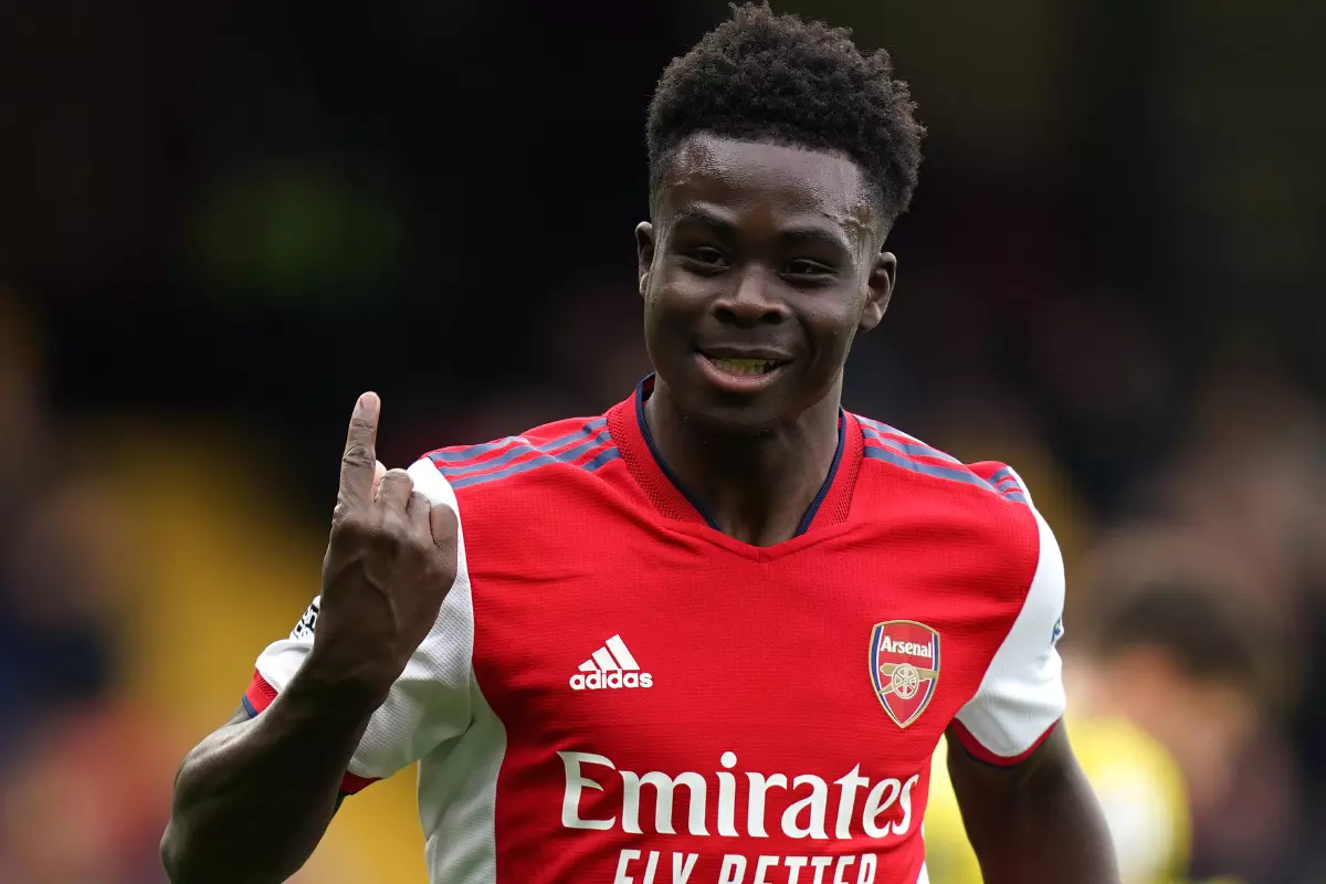 Arsenal's Bukayo Saka celebrates scoring their side's second goal of the game during the Premier League match at Vicarage Road, Watford.