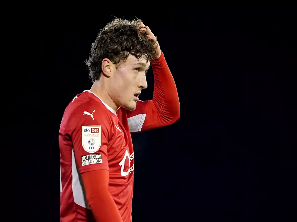 Barnsley's Callum Sytles looks dejected after their match against Swansea City