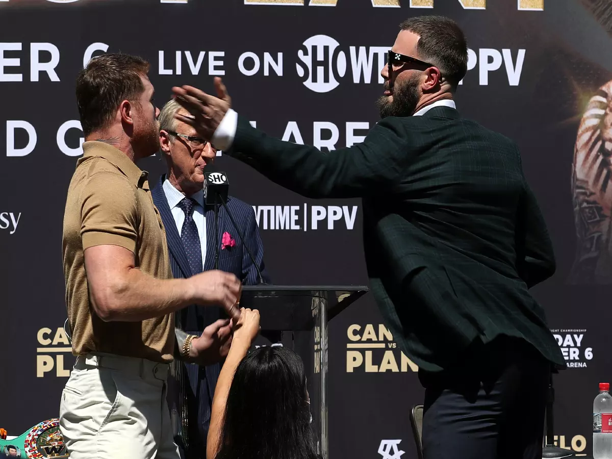 Punches were exchanged as CALEB PLANT, right, swings back at CANELO ALVAREZ, left, during a press conference Tuesday to announce their 168-pound title bout on November 6 live at MGM Grand Gar