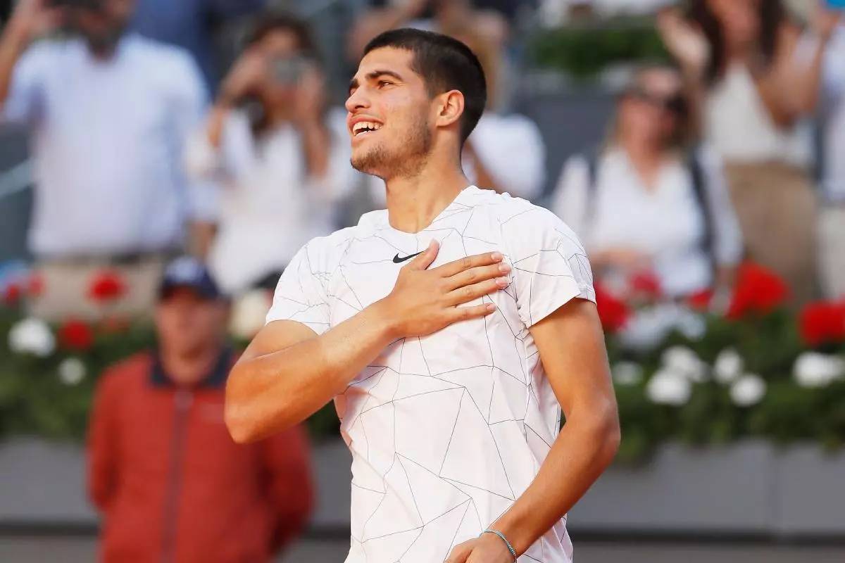 Carlos Alcaraz celebrates beating Rafael Nadal