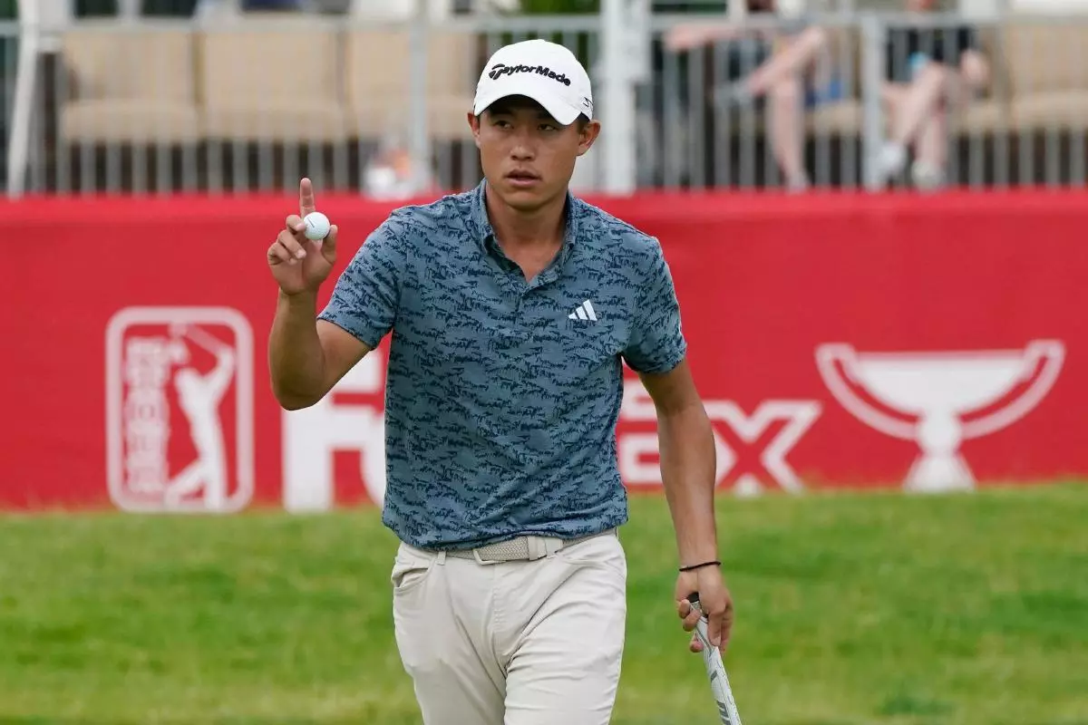 Collin Morikawa acknowledges the crowd