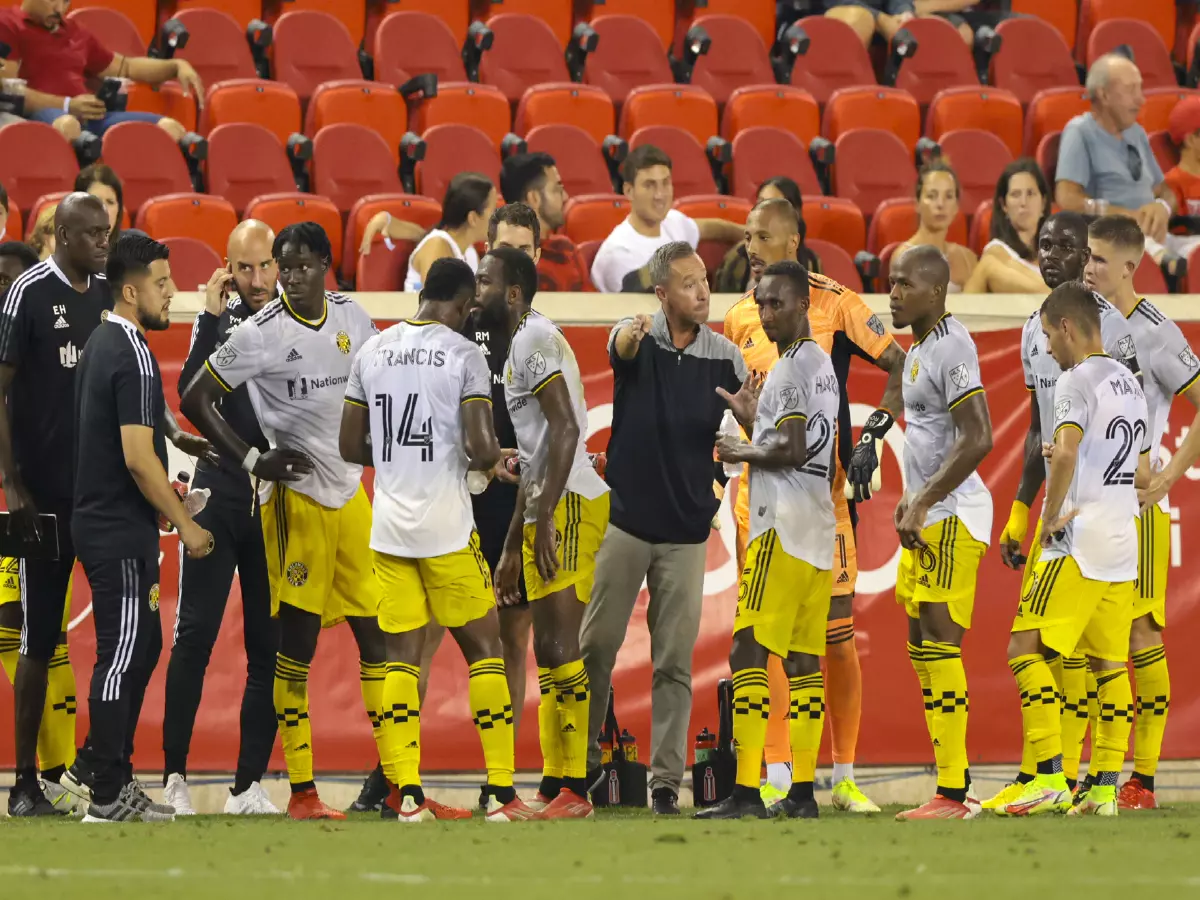 Columbus Crew head coach Caleb Porter speaks to his team during the first half against the New York Red Bulls at Red Bull Arena