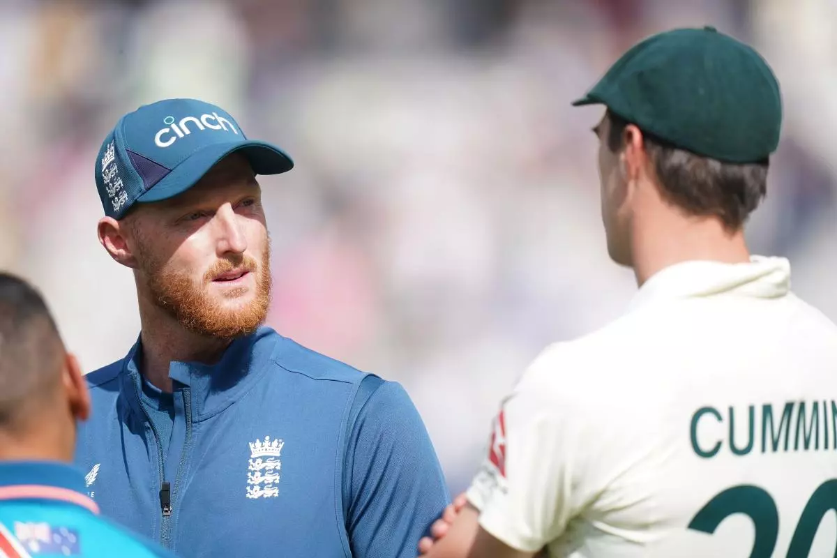 England's Ben Stokes (left) and Australia's Pat Cummins in discussion