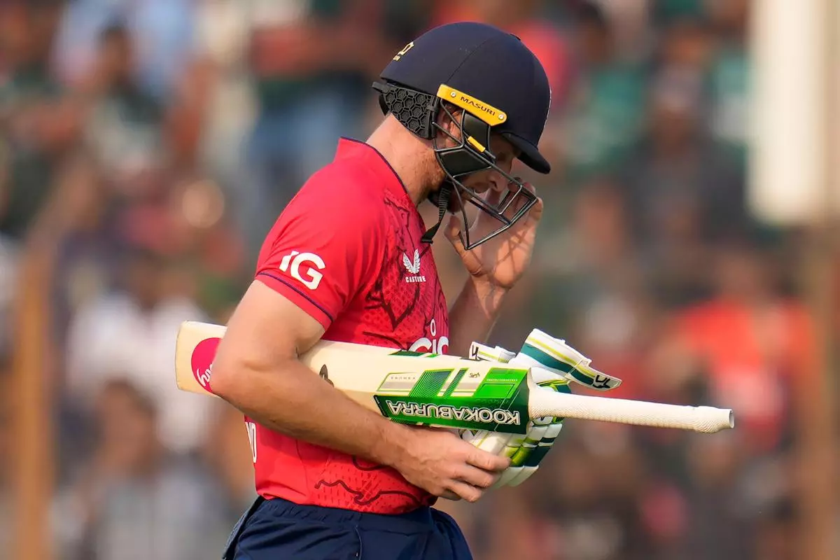 England's captain Jos Buttler walks off the field