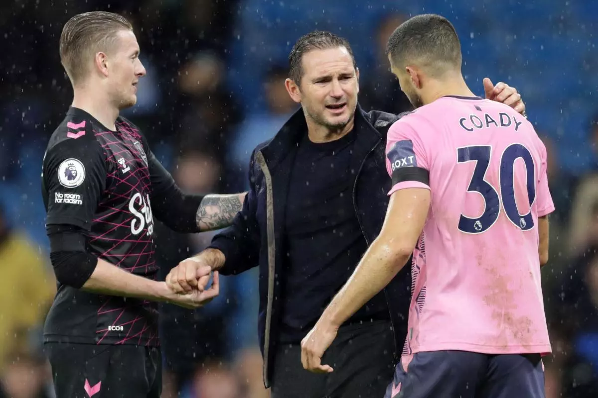 Everton manager Frank Lampard speaks with Conor Coady