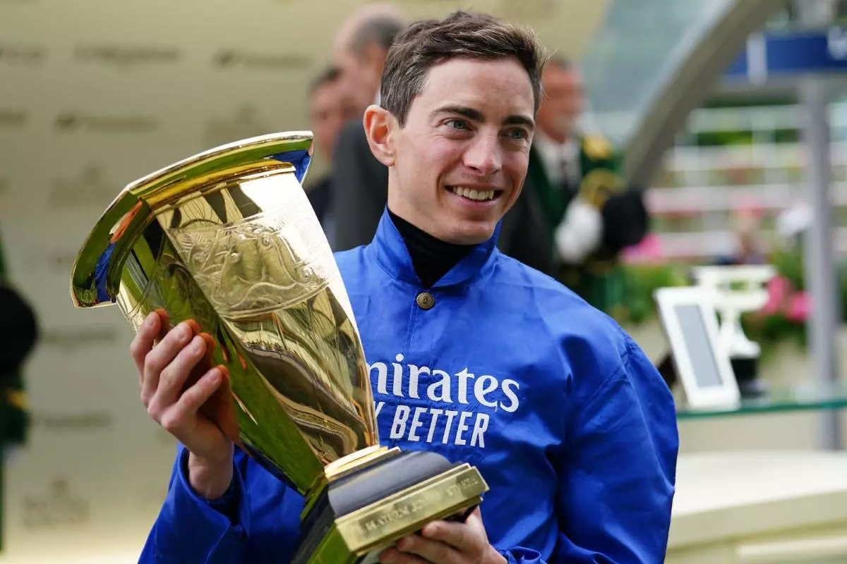 Jockey James Doyle with the trophy after winning the Platinum Jubilee Stakes on Naval Crown during day five of Royal Ascot