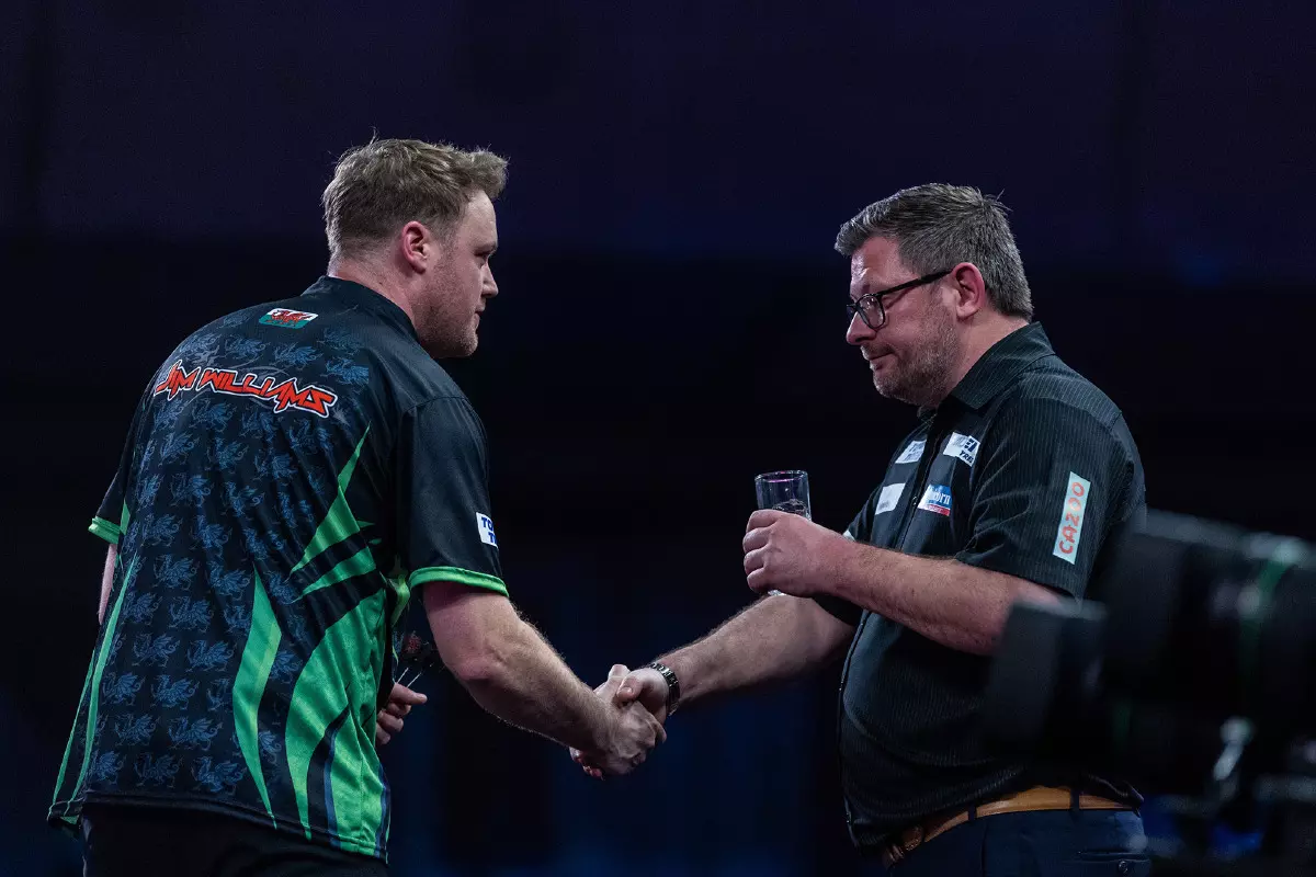 Jim Williams shaking James Wade's hand