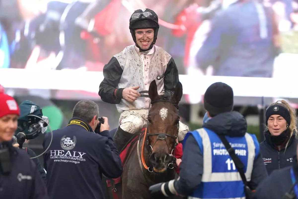 Jockey Jack Kennedy celebrates with horse Teahupoo after winning the Bar One Racing Hatton's Grace Hurdle on day two of the Winter Festival