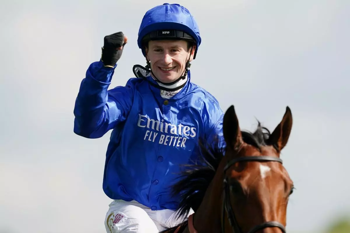 Jockey Oisin Murphy celebrates on board Mawj