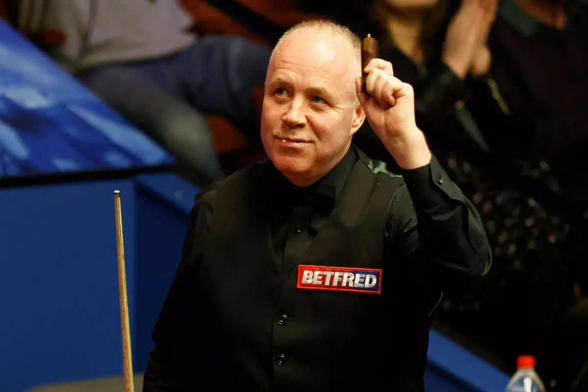 John Higgins after beating Thepchaiya Un-Nooh during day five of the Betfred World Snooker Championships at The Crucible