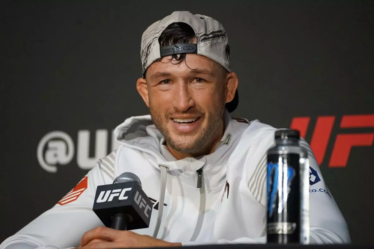 Julian Erosa speaks to the media