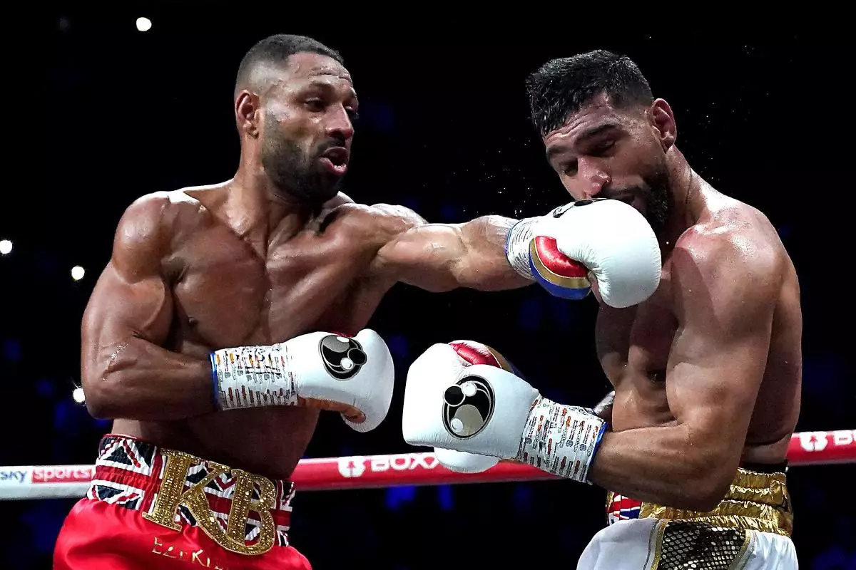 Kell Brook (left) in action against Amir Khan