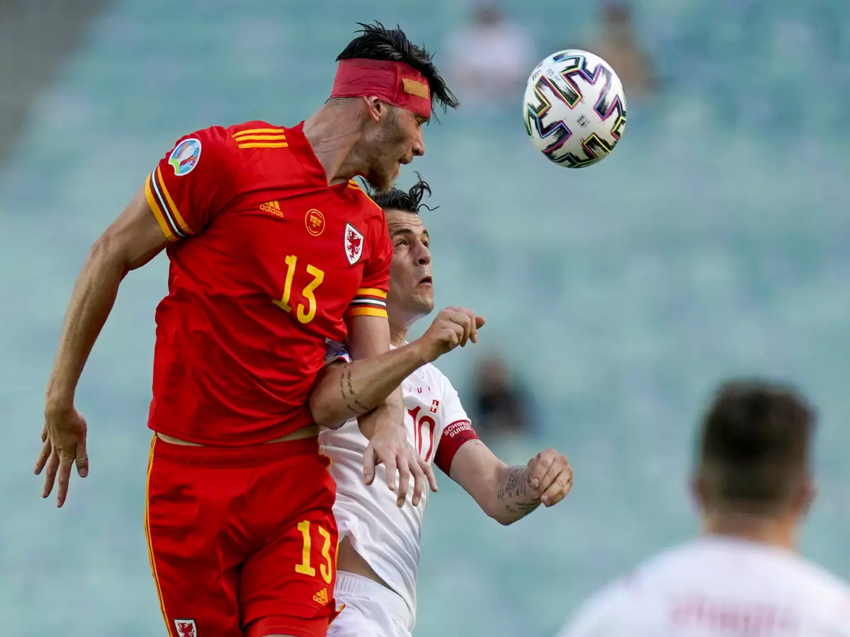Wales' Kieffer Moore (left) and Switzerland's Granit Xhaka battle for the ball in the air during the UEFA Euro 2020 Group A match at the Baku Olympic Stadium, Azerbaijan.