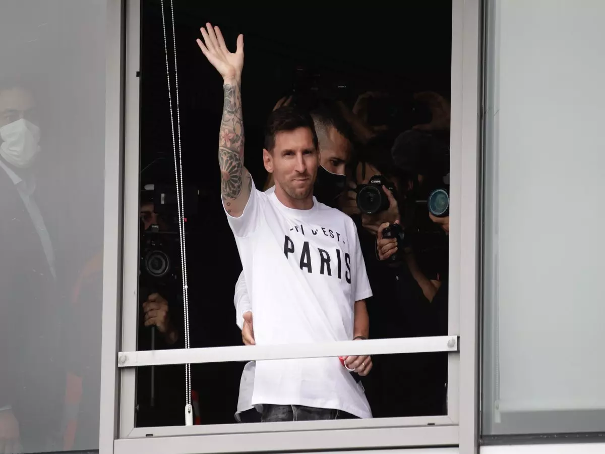 Lionel Messi Argentinian football player Lionel Messi salutes supporters from a window after he landed on August 10, 2021 at Le Bourget airport, north of Paris, to become Paris Saint-Germain'