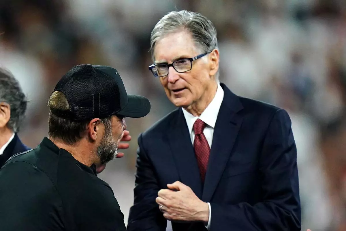 Liverpool manager Jurgen Klopp shake hands with Liverpool owner John W. Henry