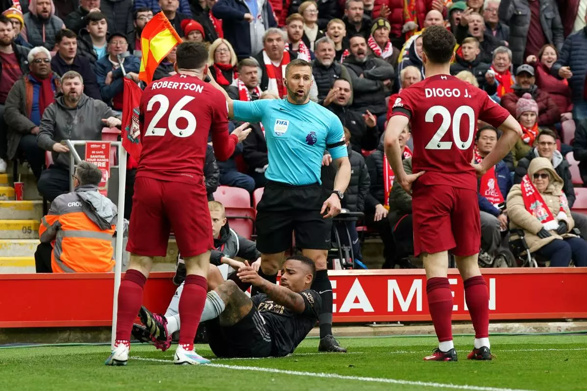 Liverpool's Andrew Robertson appeals to assistant referee Constantine Hatzidakis during the Premier League match at Anfield = April 2023
