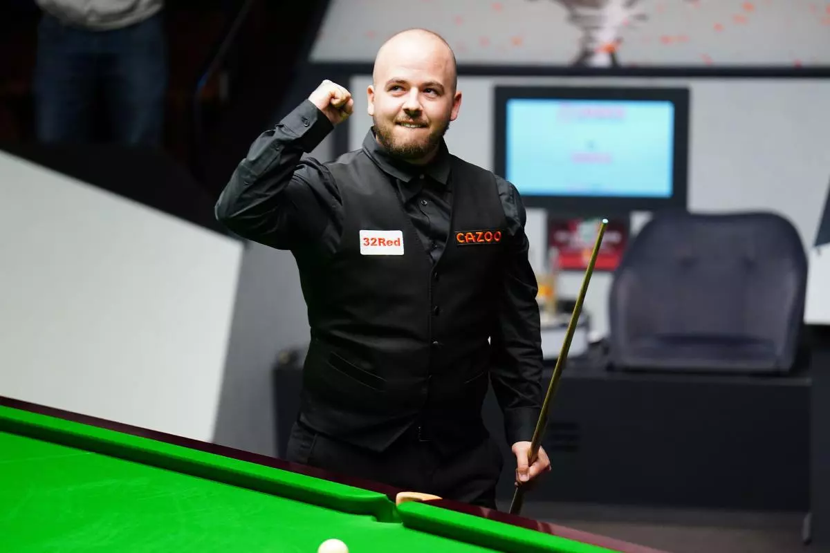 Luca Brecel reacts after winning his match