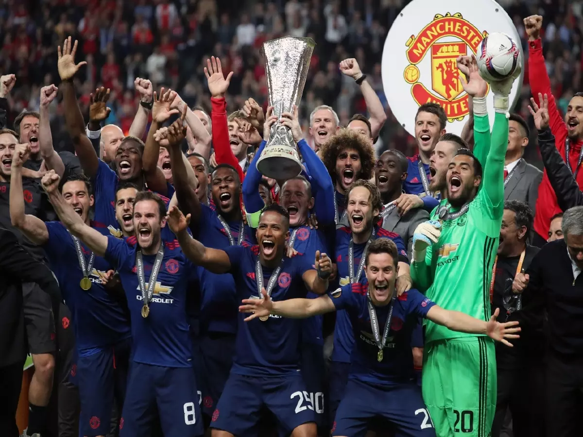 Wayne Rooney lifts the Europa League trophy with Manchester United in May 2017