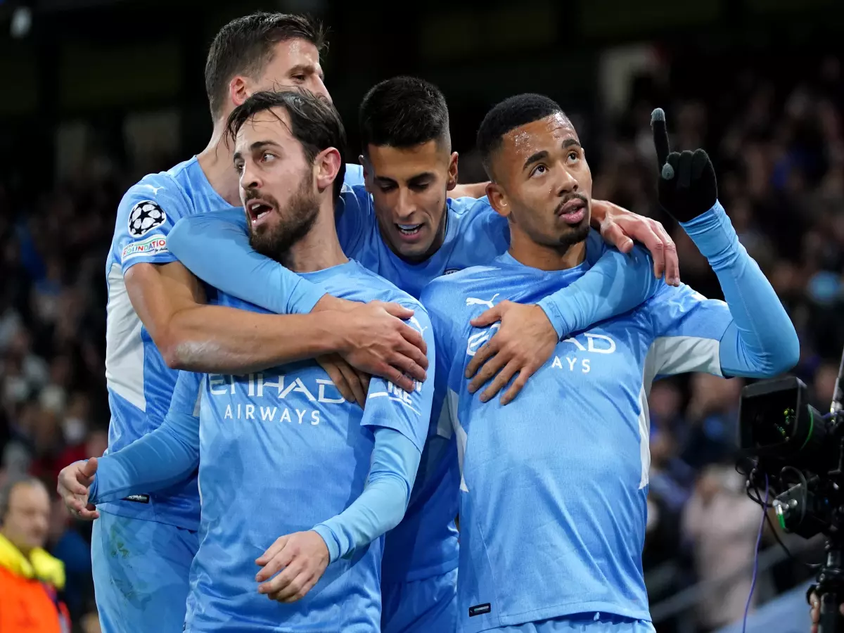 Manchester City's Gabriel Jesus (right) celebrates with team-mates after scoring their side's second goal of the game during the UEFA Champions League, Group A match at the Etihad Stadium, Ma