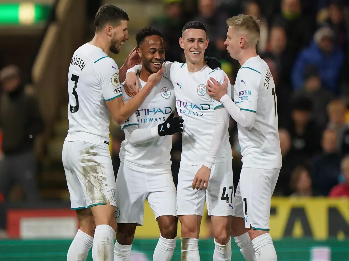 Manchester City's Raheem Sterling (second left) celebrates with his team mates scoring his sides third goal of the game during the Premier League match at Carrow Road, Norwich. Picture date: