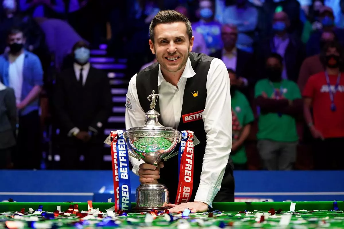 England's Mark Selby posses for photos after winning the the Betfred World Snooker Championships 2021 at The Crucible, Sheffield.